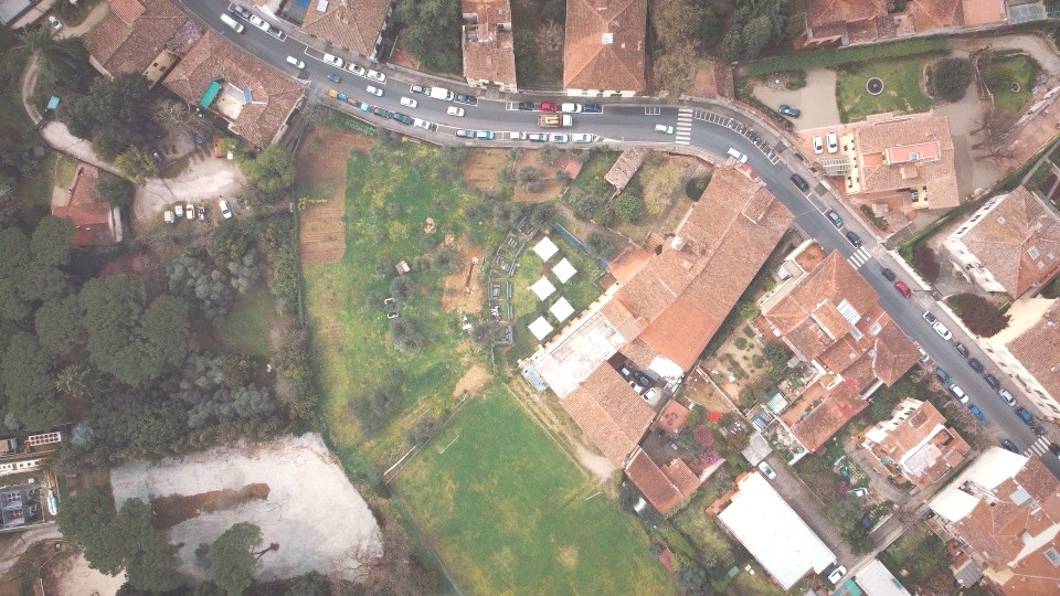 Aerial view of the Unicollege campus grounds with the white canopies in the garden