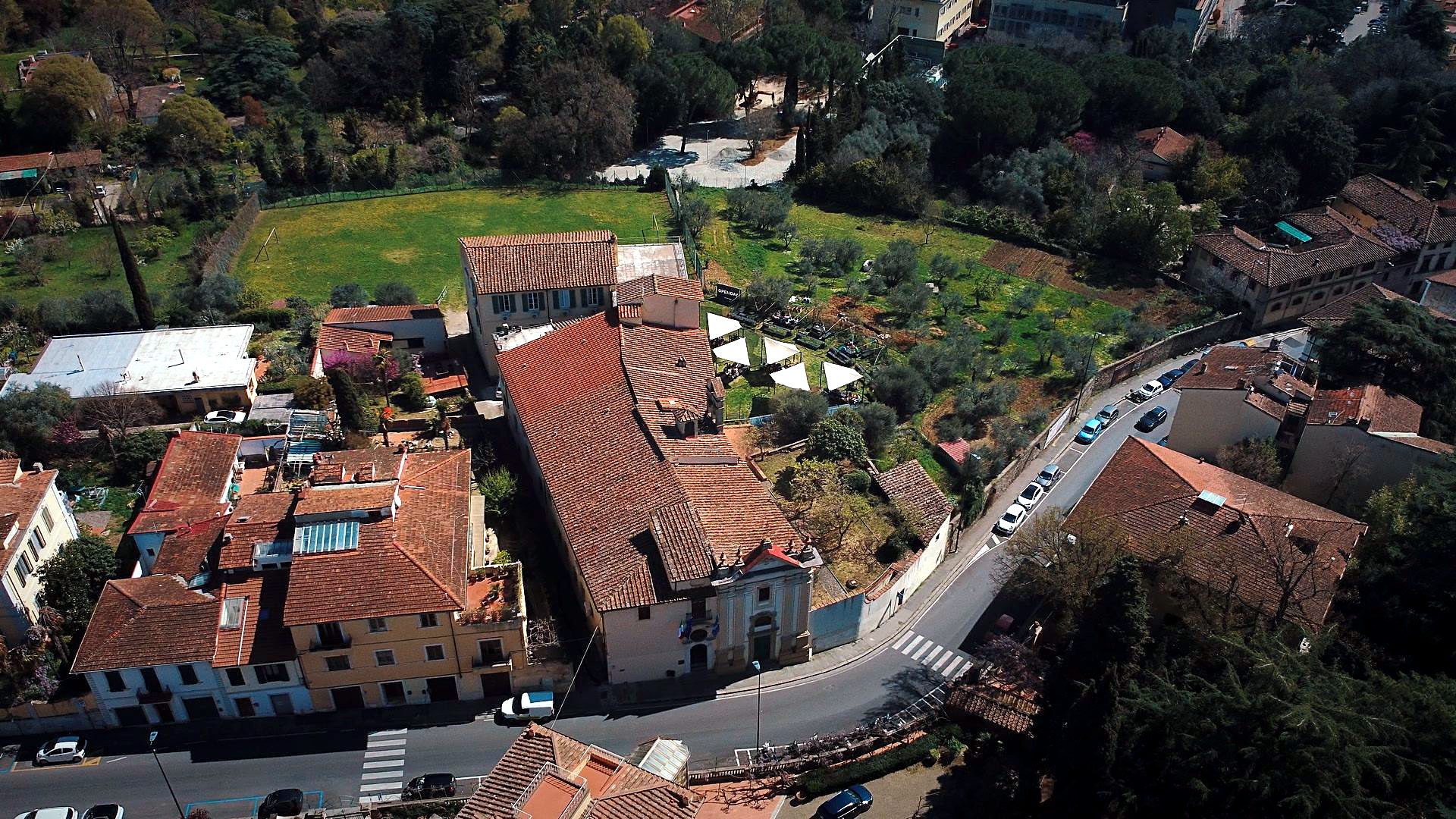 The Florence campus seen from above: the former convent, its courtyard and the garden on the hill