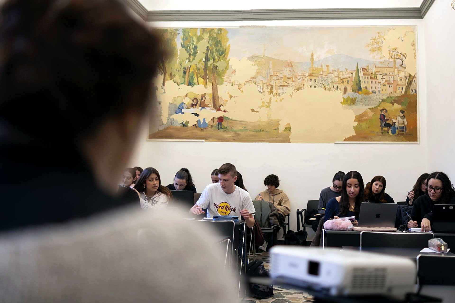 A lecture in one of the frescoed classrooms of the Florence campus
