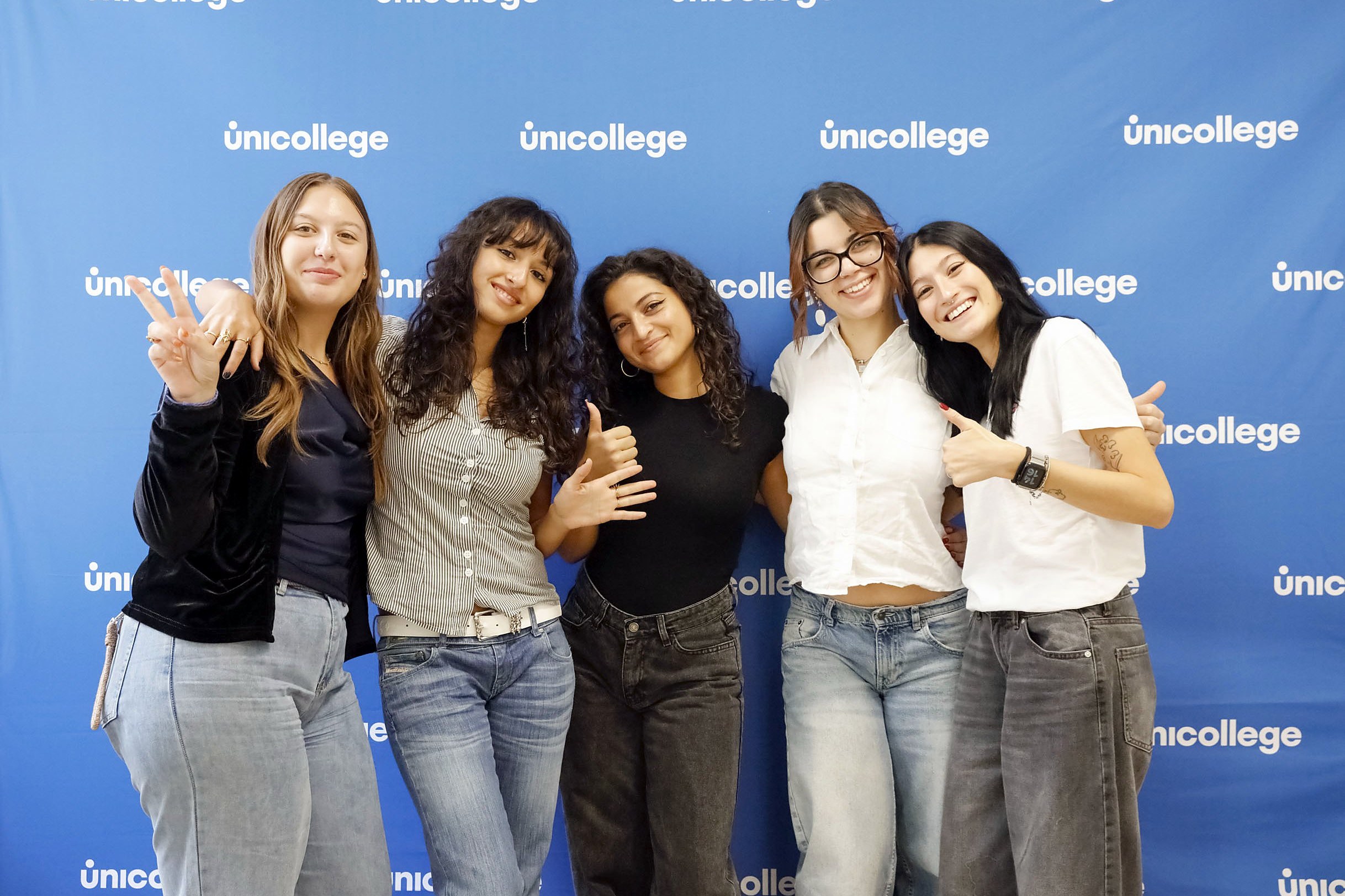 First-year students smiling together on the Unicollege campus in Turin