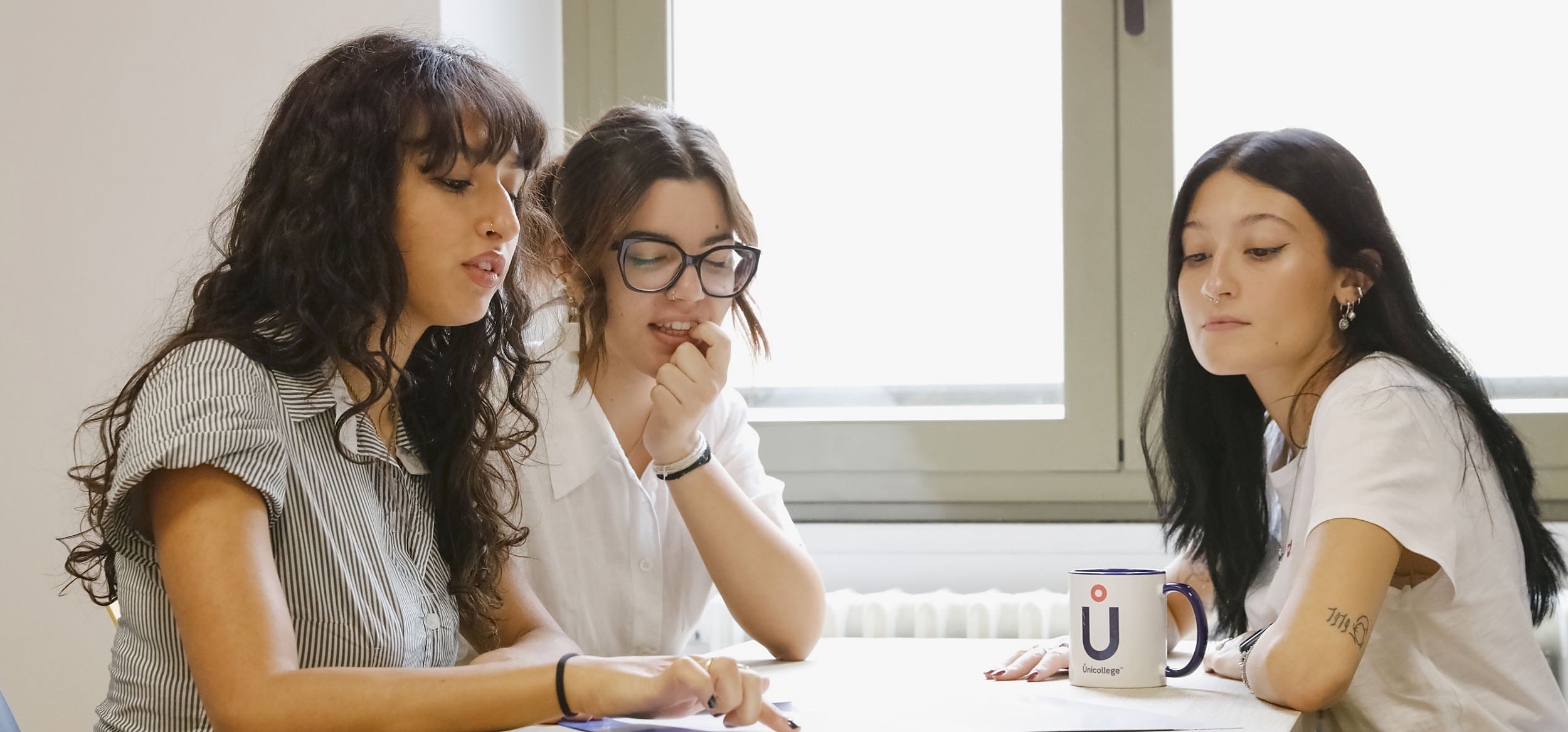 Students working together on a project at the Turin campus