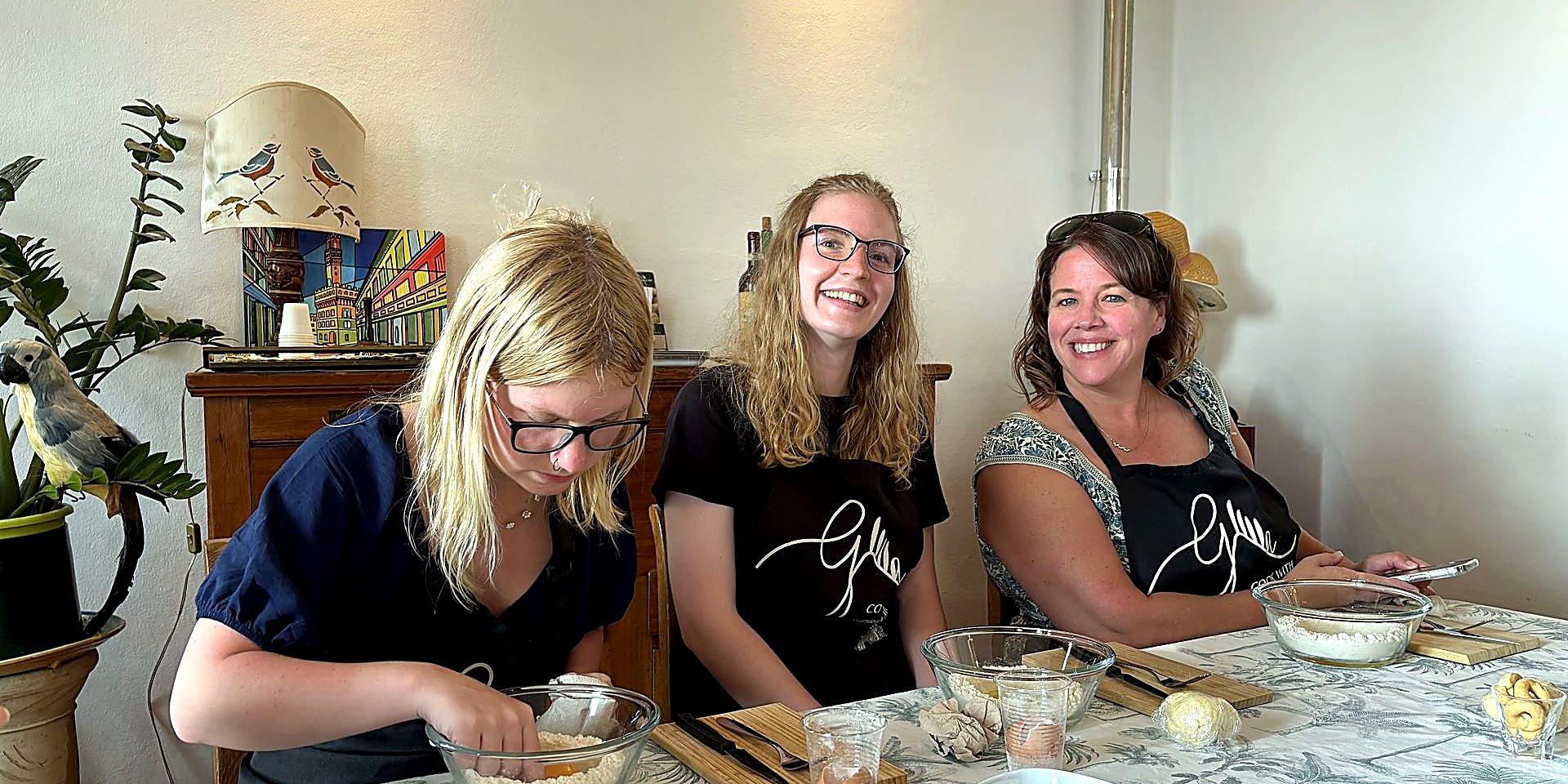Students at a hands-on Italian cooking class