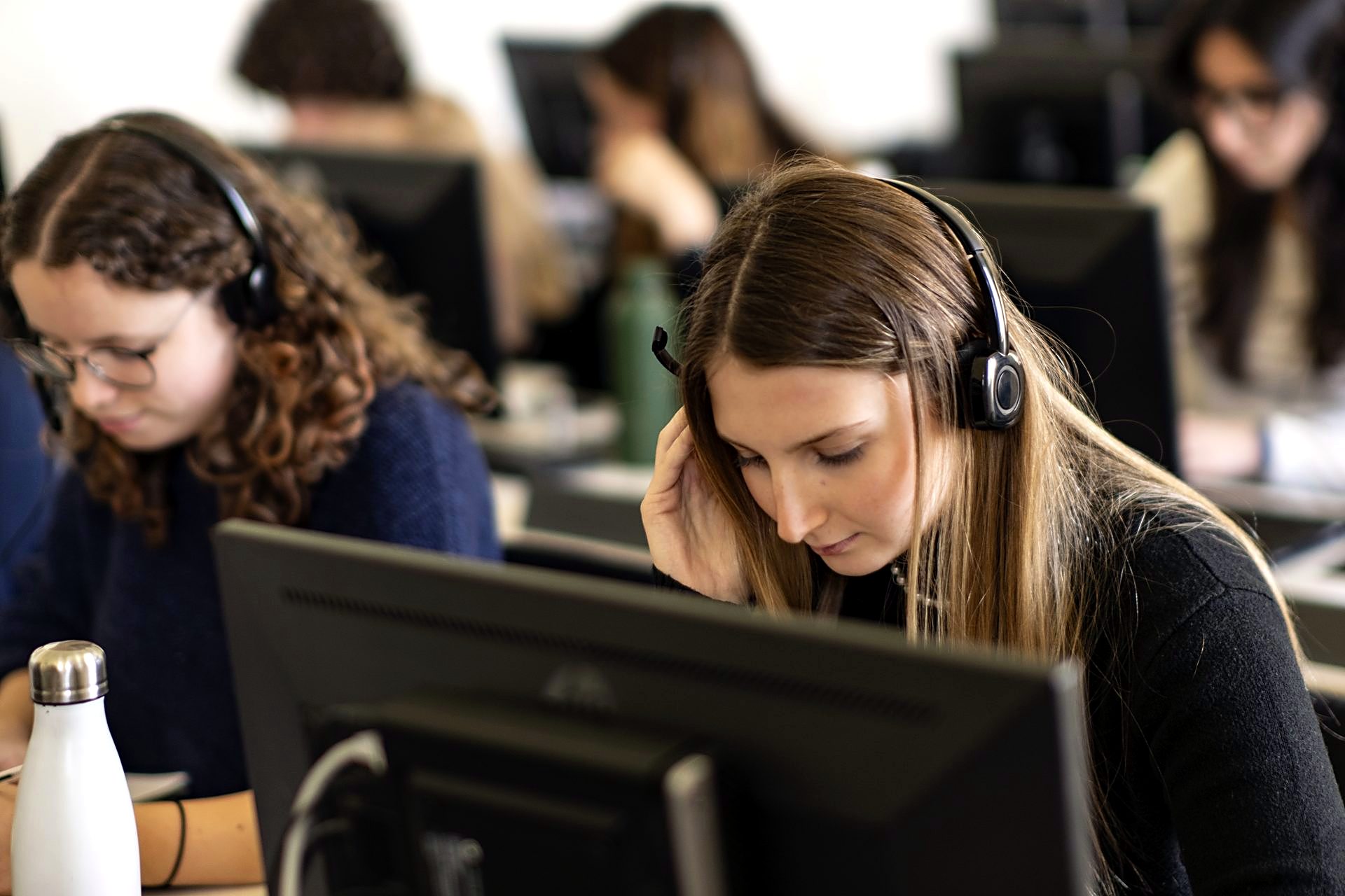 Students in the language laboratory, working with headsets at interpreting stations
