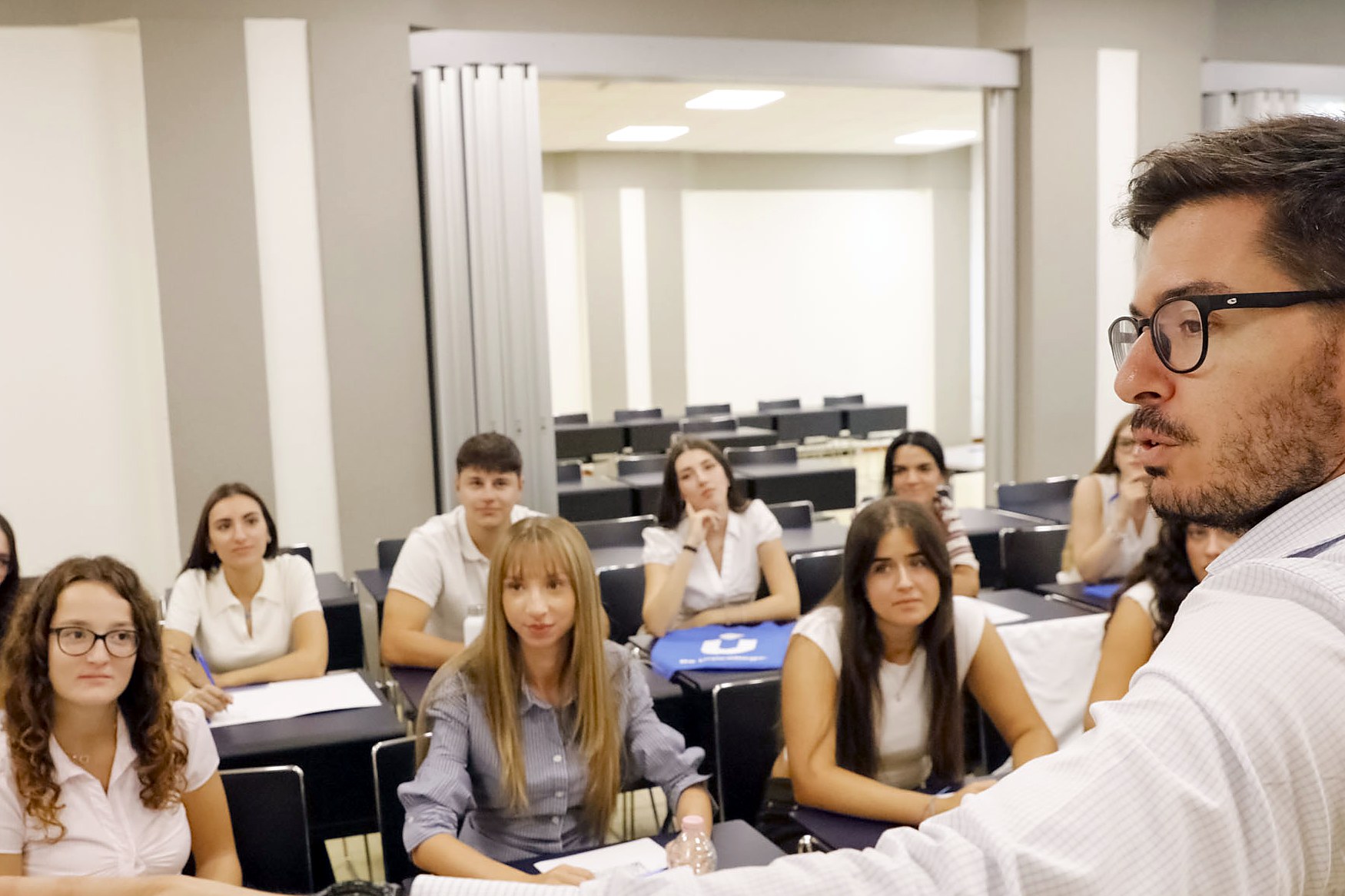 A lecturer teaching a class of students on the Mantua campus