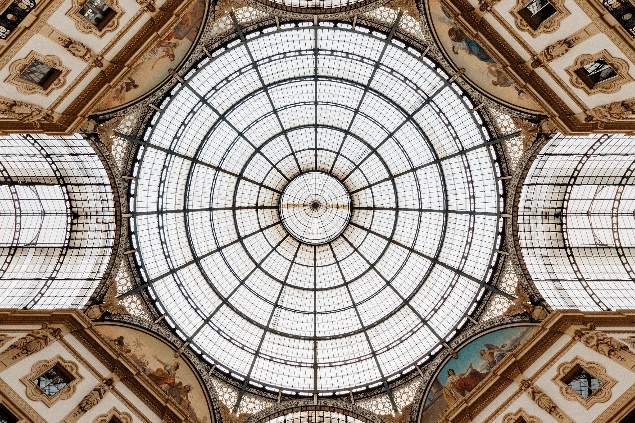 An iron-and-glass galleria dome seen from below