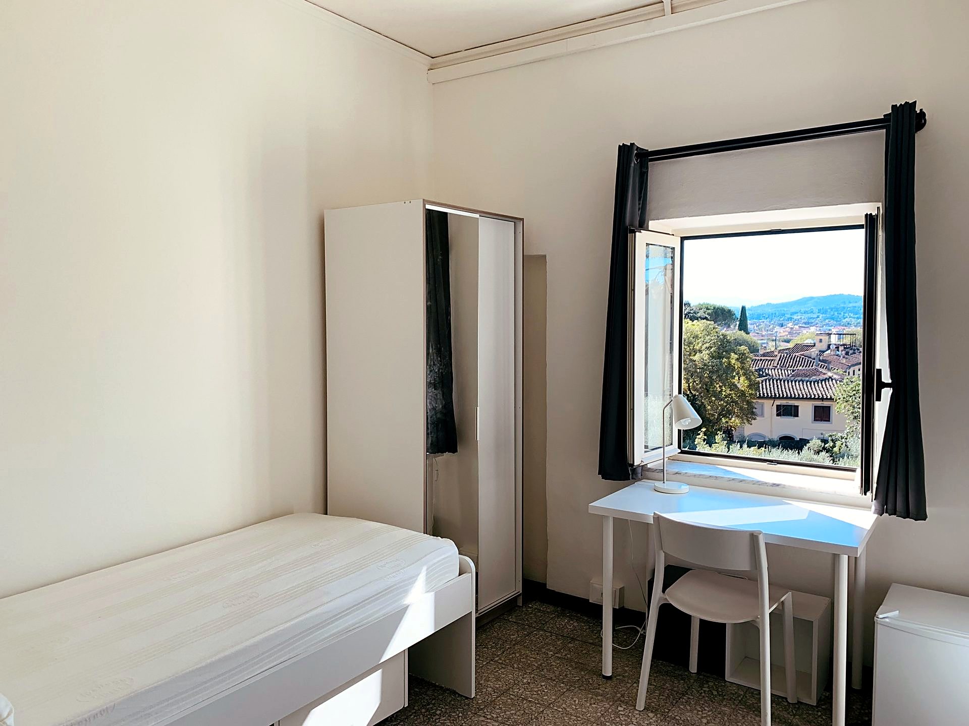 A single room in the Florence student residence, with a view over the city