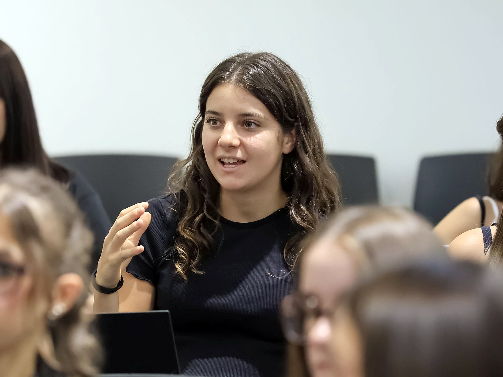 A student taking part in a class discussion at Unicollege