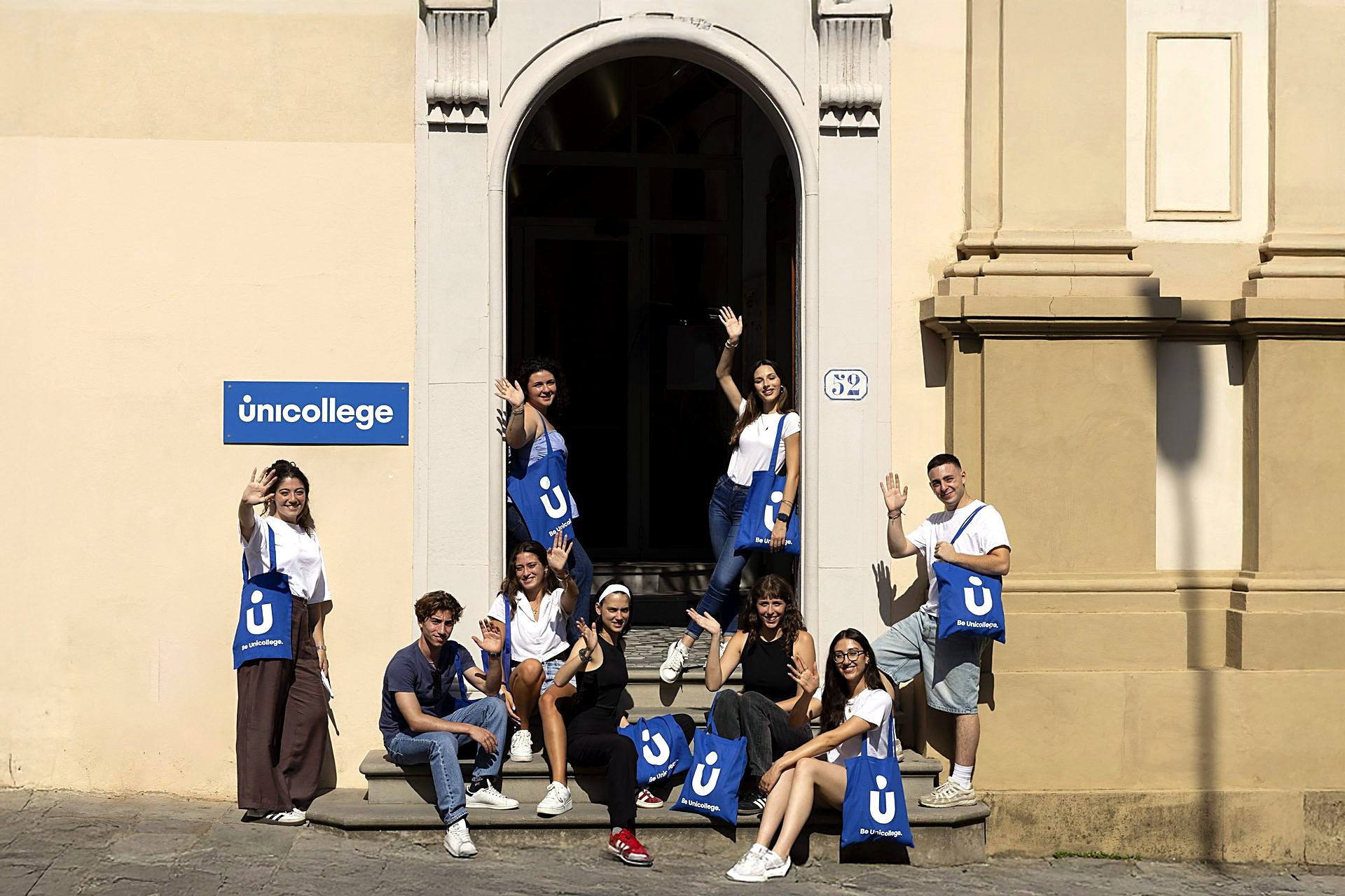 Students on the entrance steps of the Florence campus