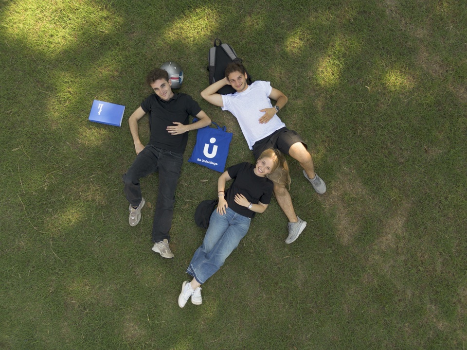 Students resting on the campus lawn, seen from above