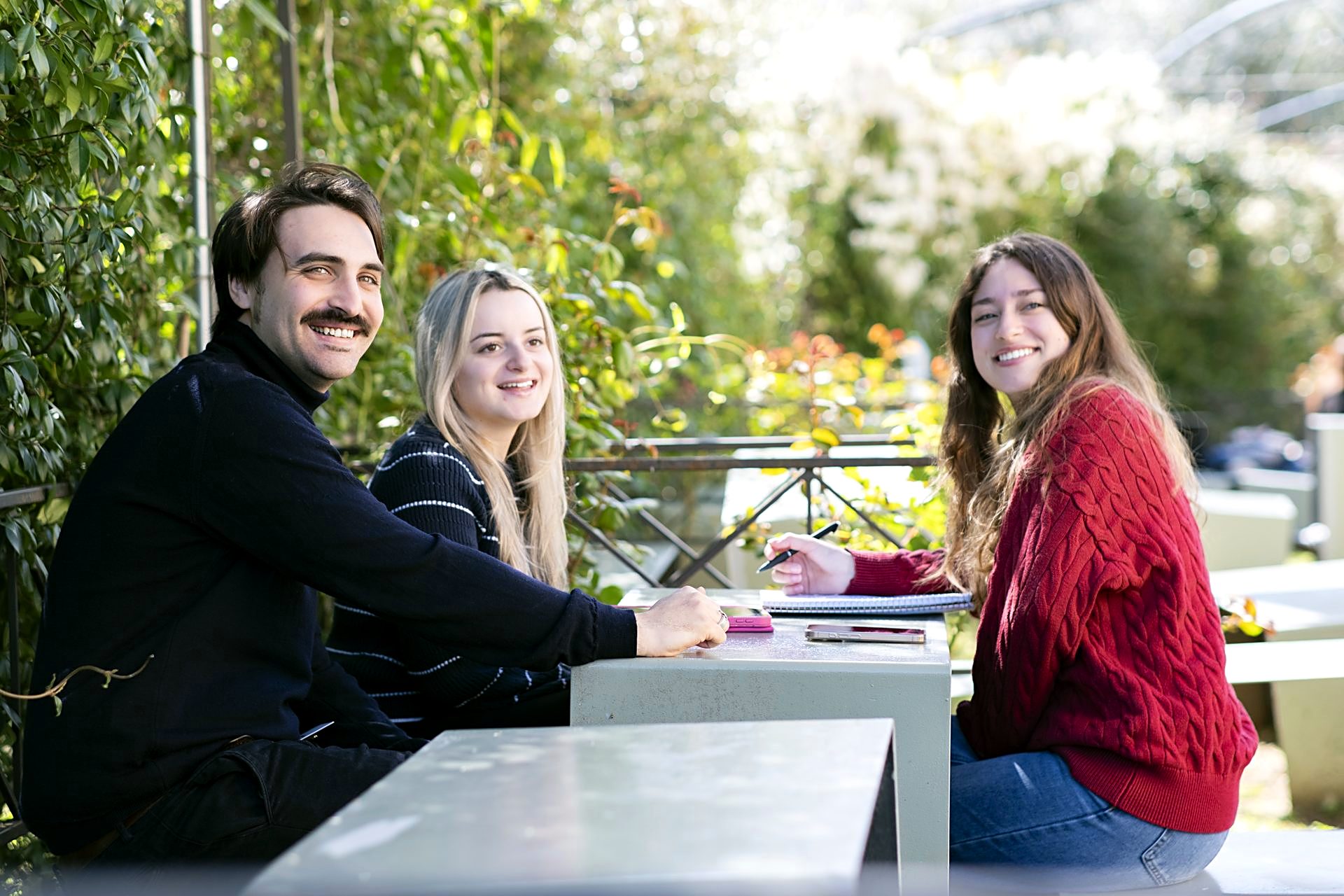 Students at the outdoor tables of the Florence campus