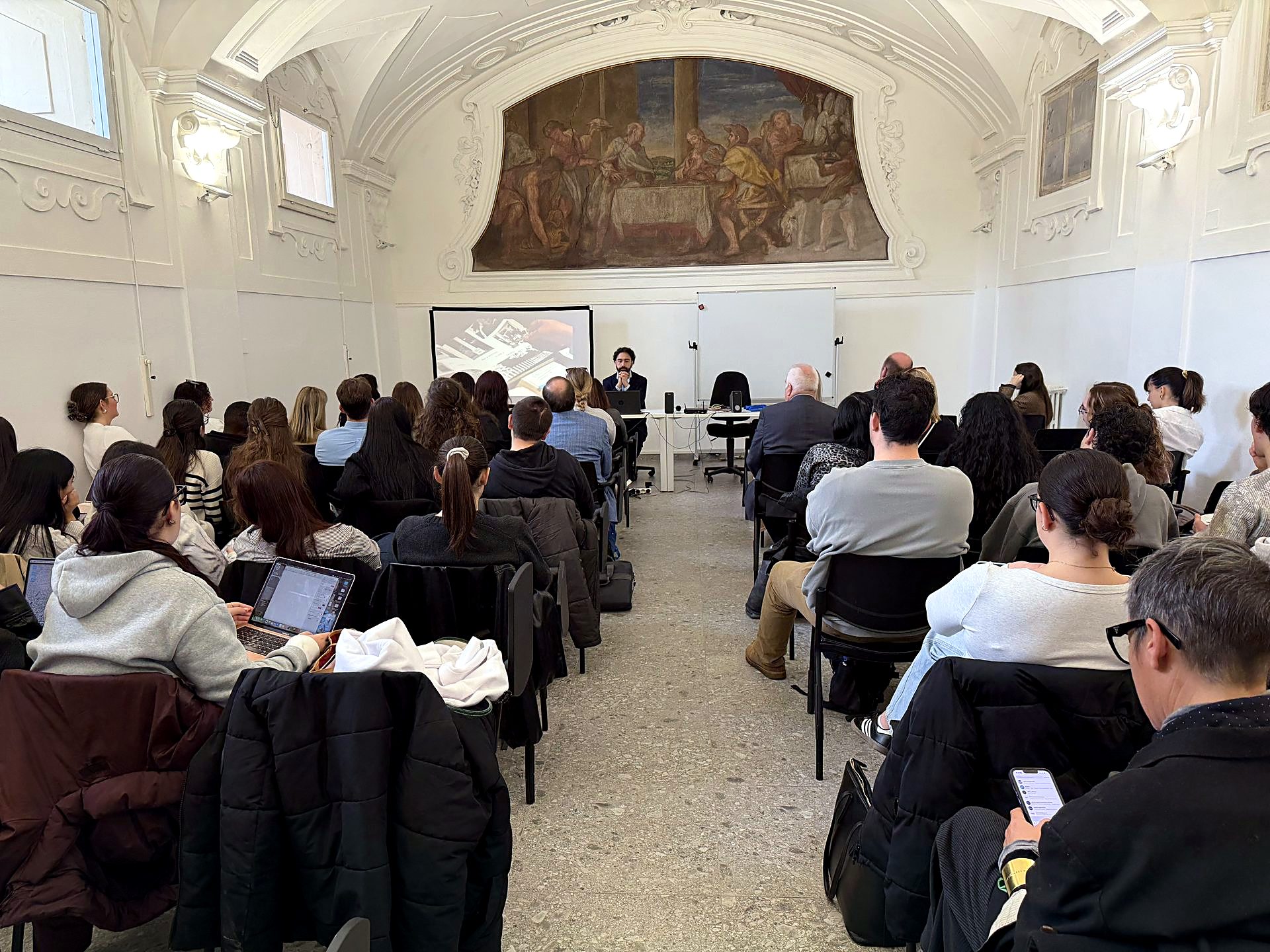 The study abroad fair in the frescoed hall of the Florence campus