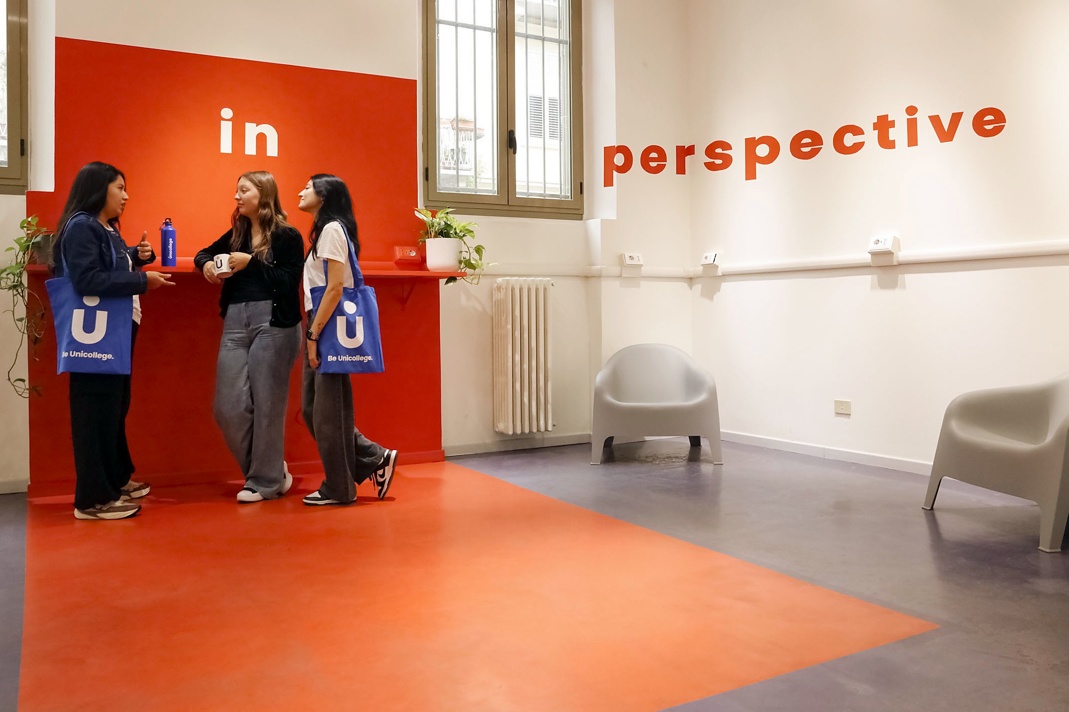 Students chatting in the In Perspective lounge of the Turin campus