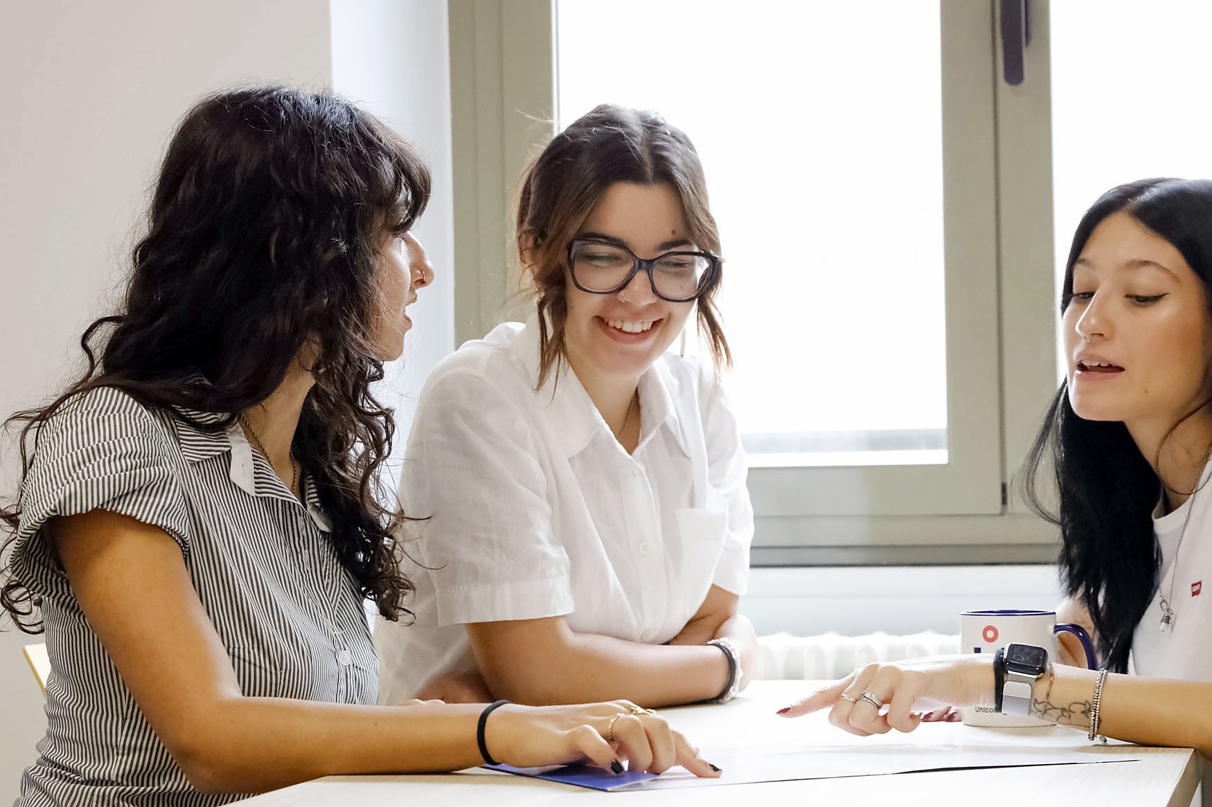 Students studying together at a table on the Turin campus