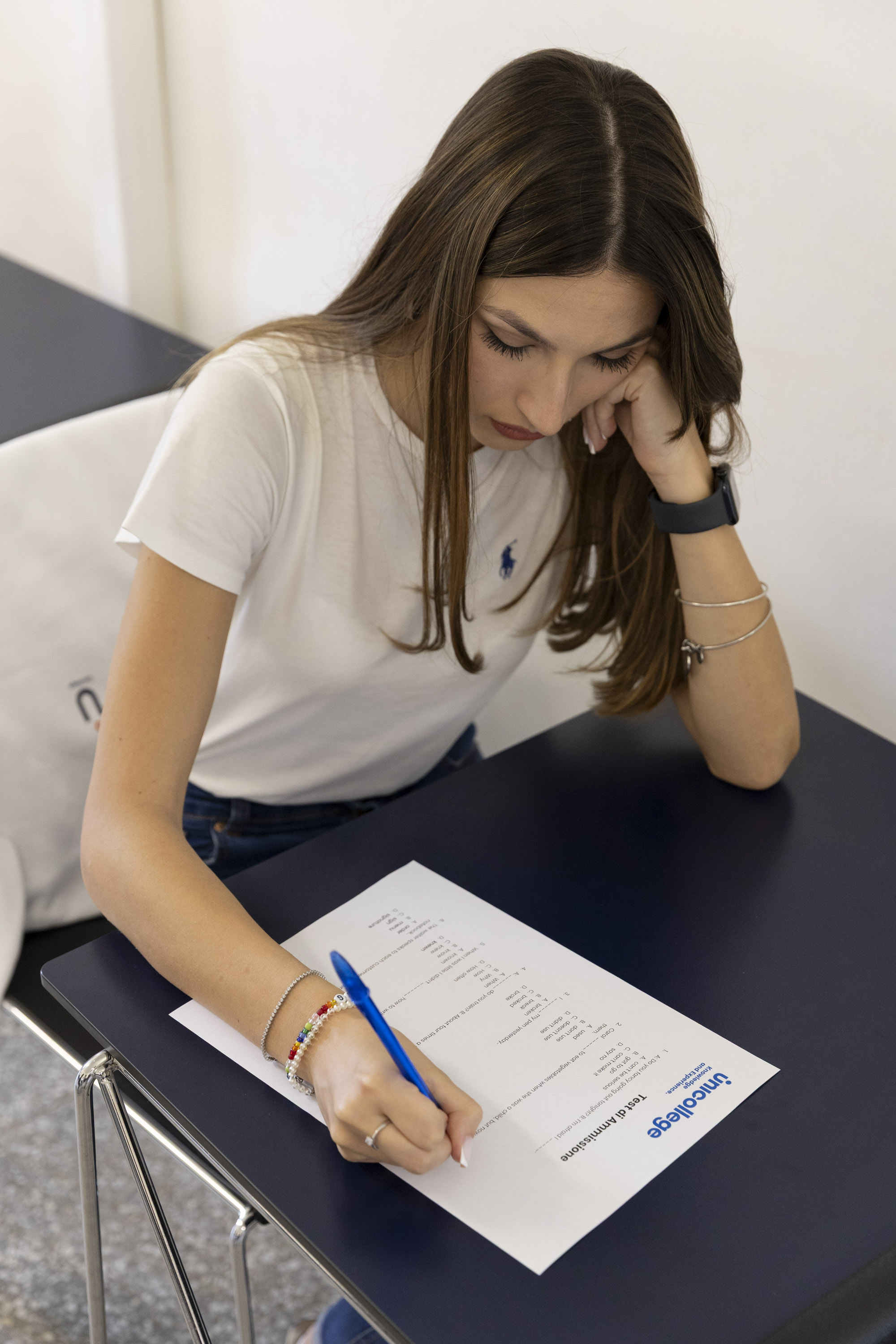 Students relaxing on outdoor steps in the sun